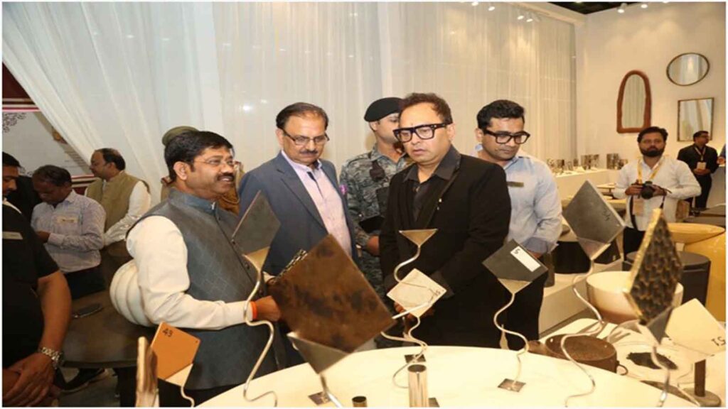 Uttar Pradesh Minister Nand Gopal Nandi visiting a handicraft exhibition stall at IHGF Delhi Fair Autumn 2025, interacting with exhibitors and observing innovative craft designs.